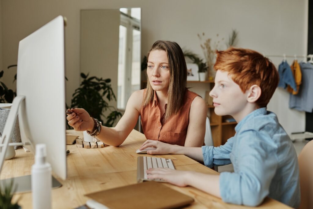 mother assisting son with academics